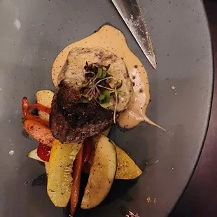 a steak and vegetables on a plate