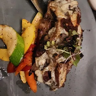 a plate of meat and vegetables