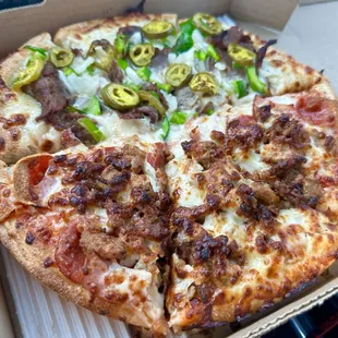 Half &quot;meat lover&apos;s&quot; and half &quot;Philly Cheesesteak,&quot; ALL delicious.