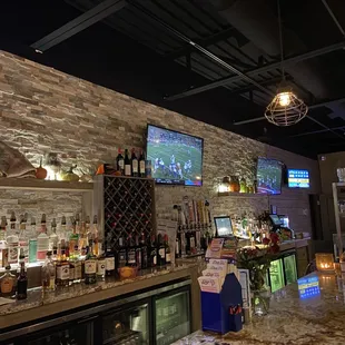 a bar with a large television