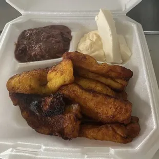 Desayuno or Breakfast, Deep fried plantains and beans, cream, and fresh cheese.