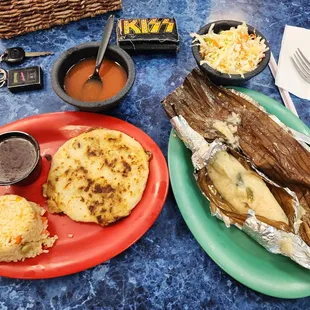 a plate of food and a basket of condiments