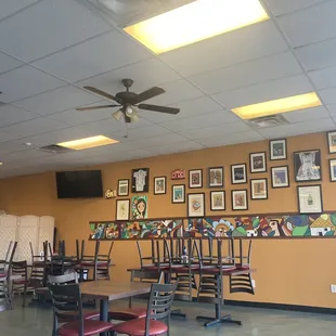 a dining area with tables and chairs