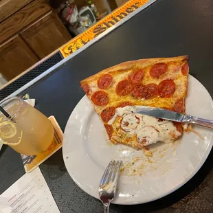a slice of pepperoni pizza with ice cream