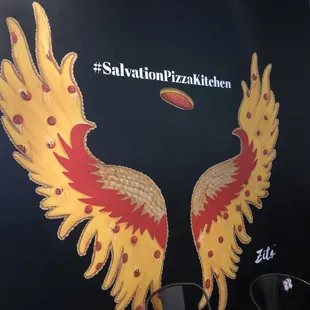 two wings painted on a wall