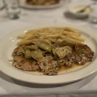 Vitello Ai Carciofi, veal in a white wine, artichoke &amp; garlic Demi glaze...my go to dish.