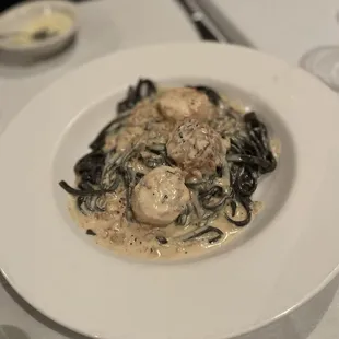 Special, squid ink linguine in a rich, creamy sauce topped with tender, juicy seared scallops.