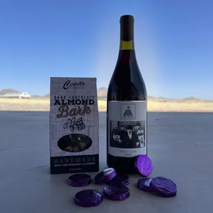 a bottle of wine and a package of chocolates