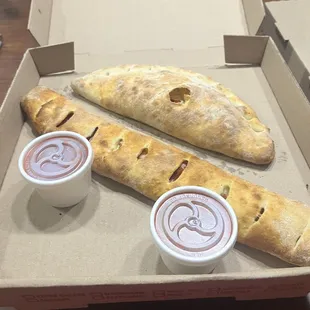 a baguet and two dipping sauces