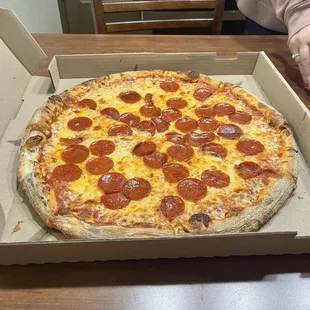 a pepperoni pizza in a box