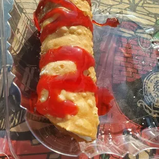 a slice of pizza with ketchup and ketchup