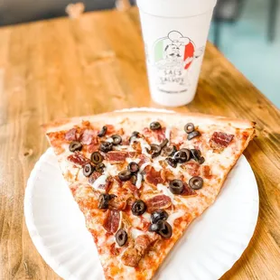 Slice of Pizza with bacon and black olives