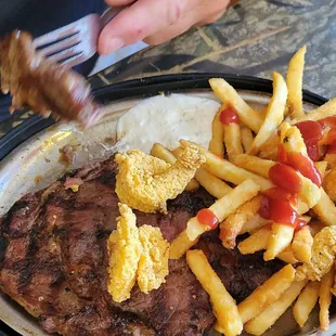 12 ribeye,  butterfly shrimp. Fries