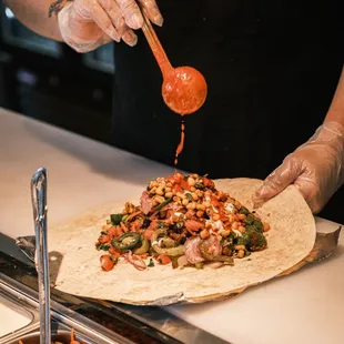 That sauce action on our curry burrito...