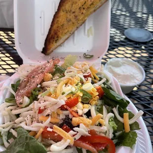 Side salad with blue cheese and garlic bread