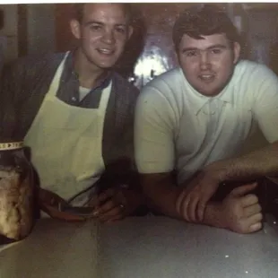 Mike Knight and Buddy Stevenson and a jar of pickle pigs feet