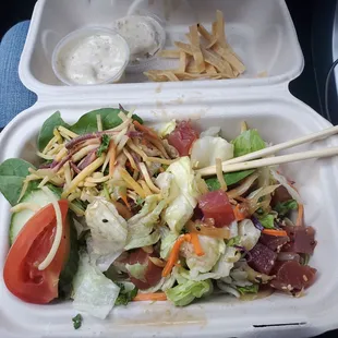 Poke Salad with flimsy iceberg lettuce and dried out slivered carrots