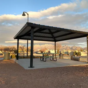 Covered picnic table with a gorgeous view of the Organ Mountains.