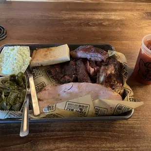 3 Meat Combo: BBQ Ribs, BBQ Pork, Smoked Turkey, Sweet Slaw, cornbread, and collard greens.