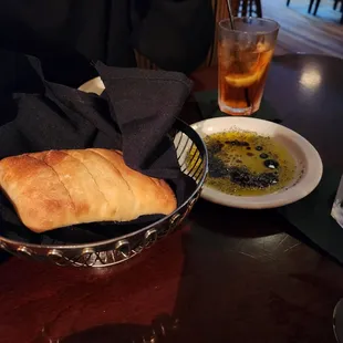 a bowl of soup and a plate of bread