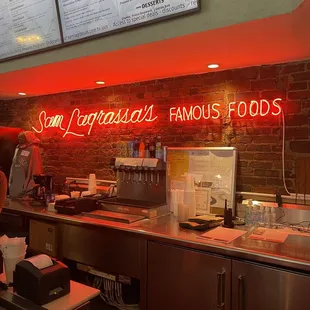 Red Neon Sign &amp; Lighted Menu in the background  @ Sam LaGrassa&apos;s in Downtown Boston.