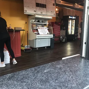 a woman standing at the counter