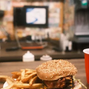 Triple cheese burger with bacon and fries