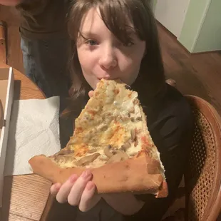 Kids eating Sam's pizza