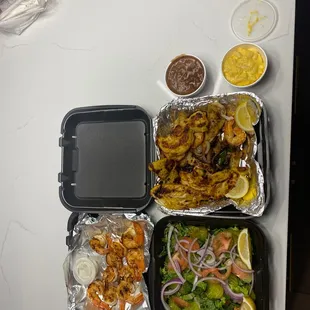 Grilled shrimp salad and grill fish shrimp and chicken combo with red beans and rice and mac and cheese