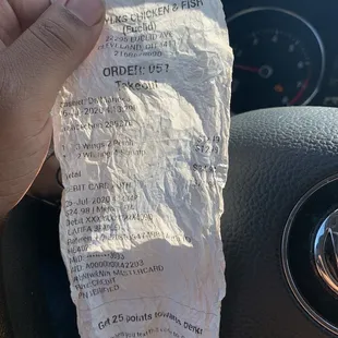 Receipt and nasty food with an eyelash in it