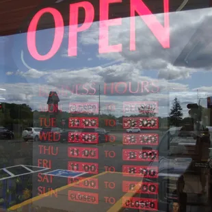 Hours of operation, front entry door.