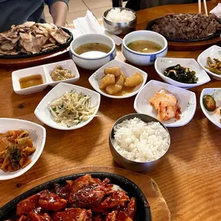 Top left: Crispy pork belly. Top right: Bulgogi. Bottom center: Spicy BBQ chicken.