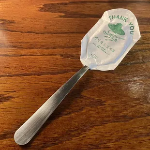 a spoon with a bag on it