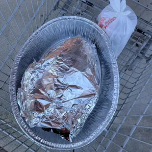 a bag of food in a shopping cart