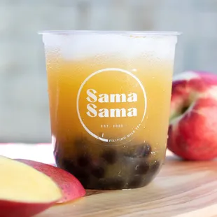 a glass of apple juice and sliced apples
