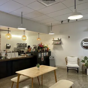 a coffee shop with tables and chairs