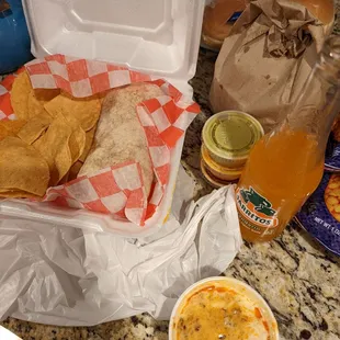Burrito, chips, and choriqueso