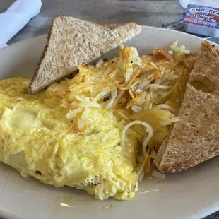 Sausage and cheddar omelette with shredded hash browns