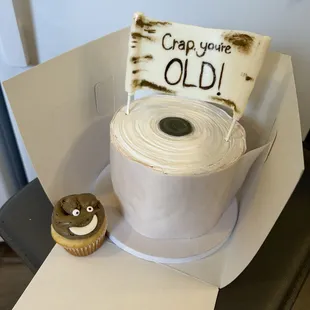 a roll of toilet paper and a cupcake