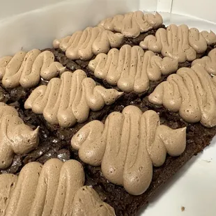 Chocolate brownies with chocolate icing.