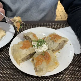 Uzbek Traditional Khonim  $13.99 (Steamed pasta rolls with beef, potatoes, and onions topped with sour cream)