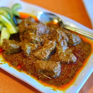 Beef rendang. Melts in your mouth and flavor is on point.