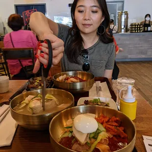 Scissors are included on your trays of naengmyun so you can cut the noodles yourself at your table.