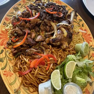Family style chicken and beef suqar with noodles and rice