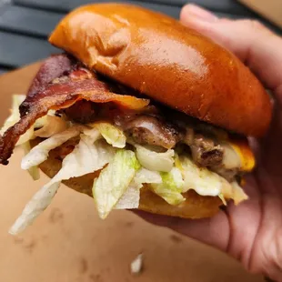 Bacon bacon cheddar burger / crispy thick cut bacon, bacon-onion jam, white cheddar, crispy lettuce, and mayo