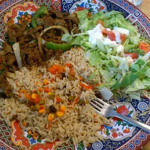 This is what 7 bucks get you. Beef kabob, spiced rice, and a salad.