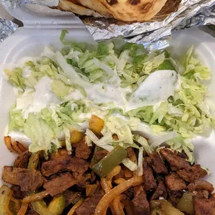 Suqaar &amp; Ceeysh.  Beef sauté with two massive pieces of pan bread.