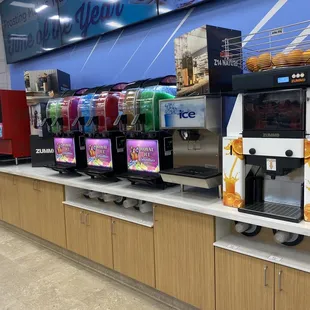a row of soda machines
