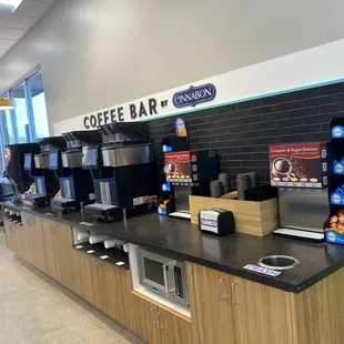 a coffee bar with coffee machines
