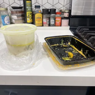 a plastic container and a plastic container on a kitchen counter